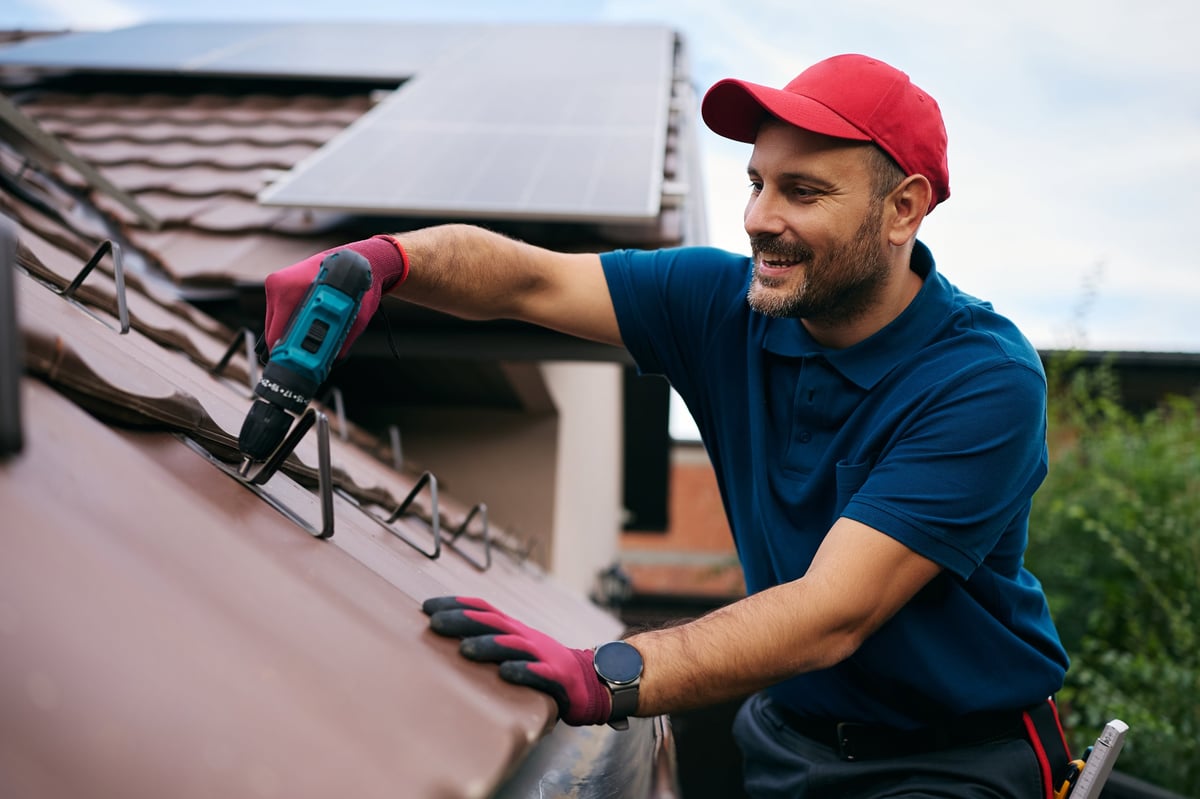 Happy roofer working on maintenance